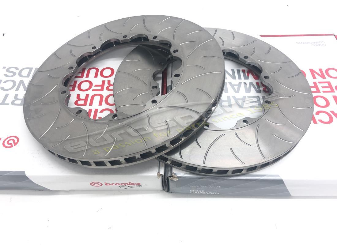 new (other) ferrari front and rear slotted brake discs. part number 70000602b (1)