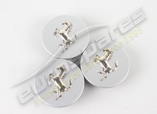 nuovo ferrari coppia copriruota in alluminio rilievo cavallo su grigio argento codice articolo 70001349