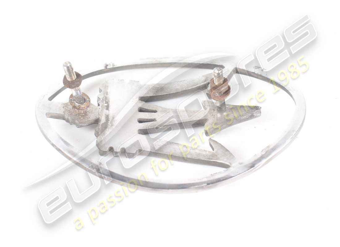 USED MASERATI SHIELD ON RADIATOR GRILL. PART NUMBER 364102304 (2) used maserati shield on radiator grill. part number 364102304 (2)